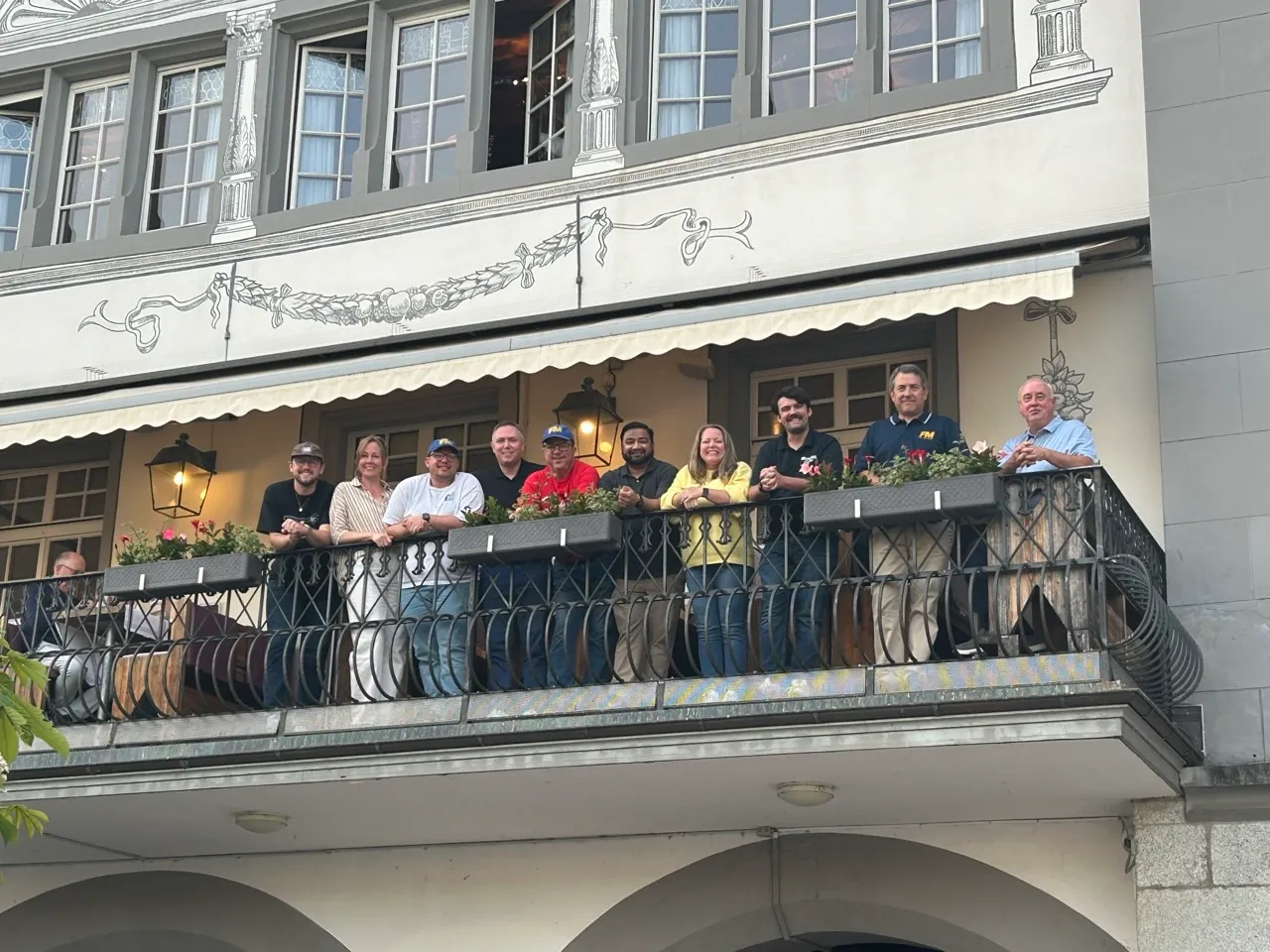 Fort Mill Band staff around a dinner table in Luzern, Switzerland